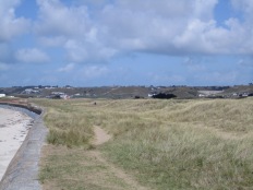 Seawall and expansive back-beach at St Ouen's Bay, Jersey (view north).